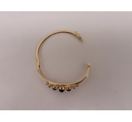 Gouden slavenarmband met granaat